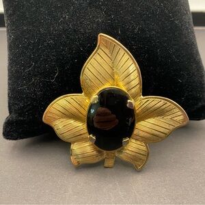 Gold Tone Floral Brooch with Black Cabochon